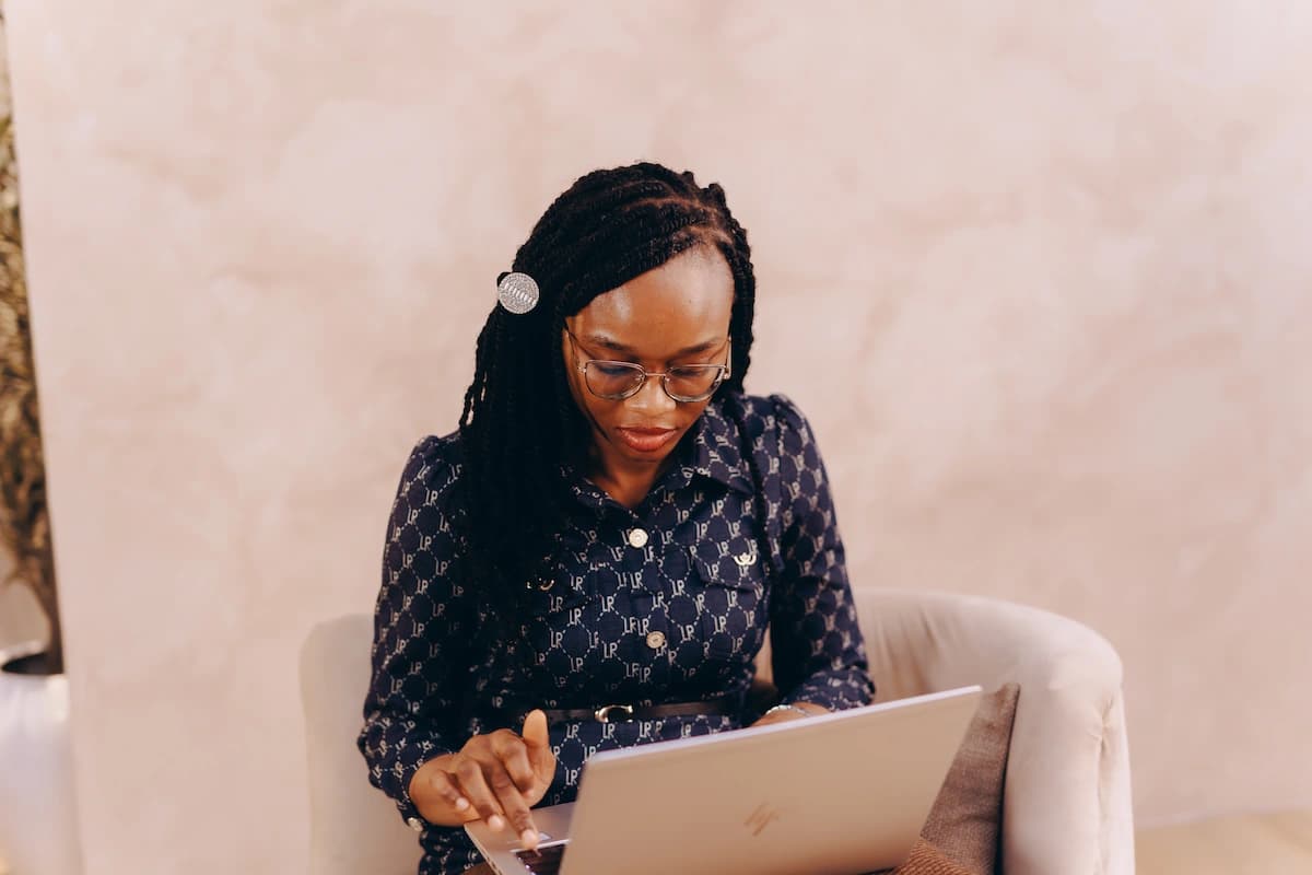 Founder of Flourishe Innovation working on a laptop
